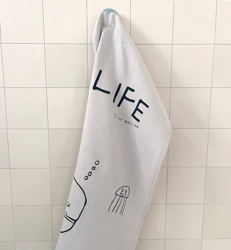 Tea towel with magnet